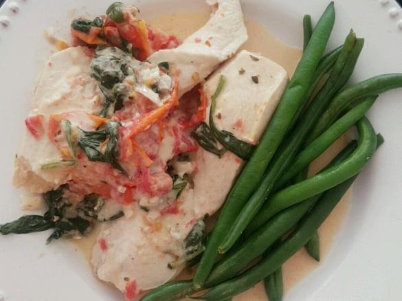 Chicken in a creamy parmesan sauce with semi-dried tomatoes and spinach