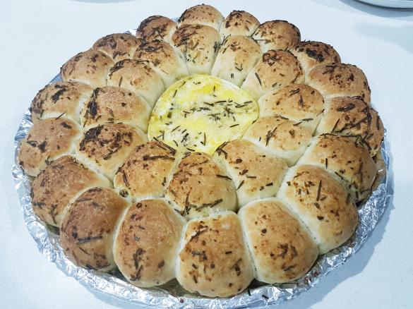 Tear and share brie, garlic + herb bread wreath