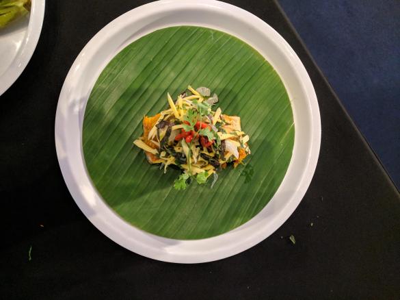 Steamed Sea bass in galangal, lemongrass & turmeric, wrapped in banana leaf & served with green mango salad - Chef Luke Nguyen