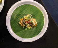 Steamed Sea bass in galangal, lemongrass & turmeric, wrapped in banana leaf & served with green mango salad - Chef Luke Nguyen