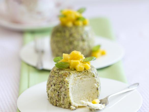 Steamed pistachio cheesecakes with mango