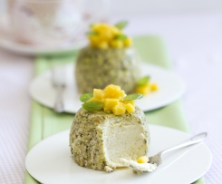 Steamed pistachio cheesecakes with mango