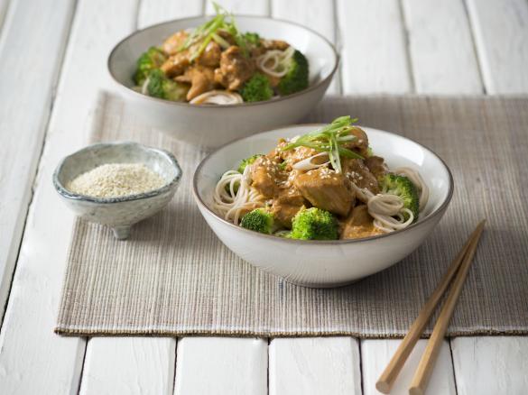 Orange sesame chicken with broccoli and noodles