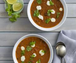 Black bean tomato soup with coriander lime cream