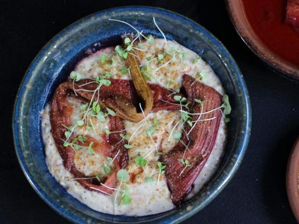 Warm almond milk rice pudding with rhubarb and rose