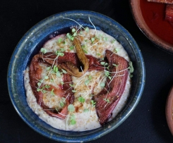 Warm almond milk rice pudding with rhubarb and rose