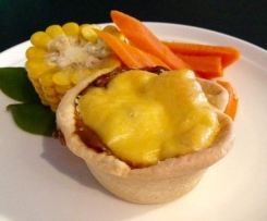 Polenta topped braised beef cheek pies