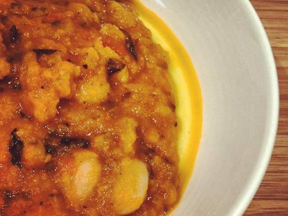 Beans with tomato and basil on polenta