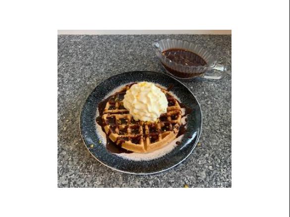 Christmas waffles with dark chocolate Cointreau pouring sauce
