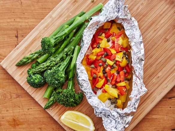 Steamed fish parcel with broccolini and asparagus