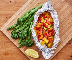 Steamed fish parcel with broccolini and asparagus