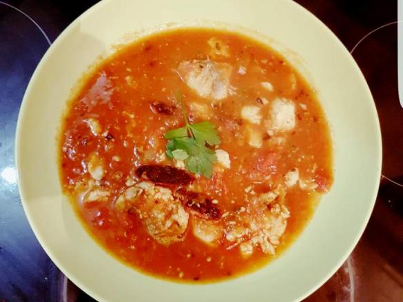 Fish soup with tomato and chorizo