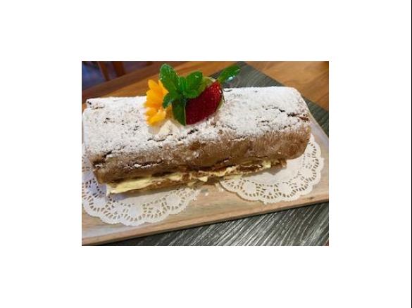 Ginger sponge roll with honey cream and jam