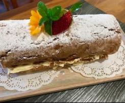 Ginger sponge roll with honey cream and jam