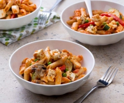 Tomato pasta with vegetables and feta