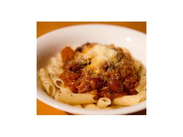 Penne with tomato and onion jam and olives