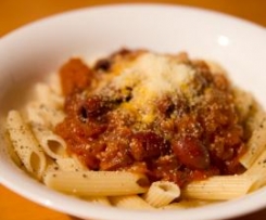 Penne with tomato and onion jam and olives