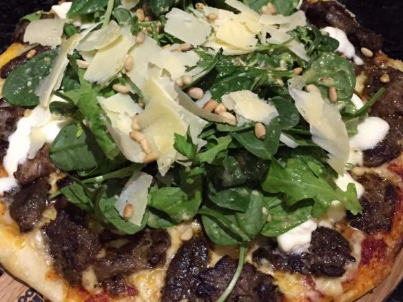 Grilled lamb pizza with rosemary and garlic vinaigrette